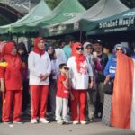 Asisten Usman mlepas jalan santai ALumniSMP ALkhairaat dalam rangka memperingati HUT ke-96 ALkhairaat di Palu, Minggu (25/8/2024). (Foto: Porkopimda Setda Kota Palu/Imron)