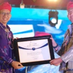 Kepala Perwakilan Bank Indonesia Sulteng, Rony Hartawan (kanan) bersama Kakanwil KemenkumHam SUlteng, Herman Siregar di arena Festival Danau Poso, Jumat (11/10/2024). (Foto: BI Sulteng)