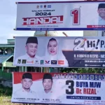 Spanduk paslon Wali Kota dan Wakil Wali Kota Palu yang dipasang KPU Kota Palu di salah satu titik dalam wilayah Kota Palu, Minggu (27/10/2024). (Foto: Humas KPU Koa Palu)