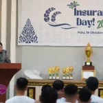Pjs Wali Kota Palu, Muschsin Husein Pakaya menyampaikan sambutan pada peringatan Hri Asuransi Nasional di Palu, Sabtu (19/10/2024). (Foto: prokopim Setda Kota Palu/Jufri)