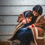 Syrian refugees Batool, 9, and her brother Abdulaziz, 7, in the Zaatari refugee camp, Jordan. Pengungsi Syria, Batool (9) dan adiknya Abdulaziz (7) di Kamp pengungsi Zaatari, Yordania. ©️ UNHCR/Shawkat Alharfoush
