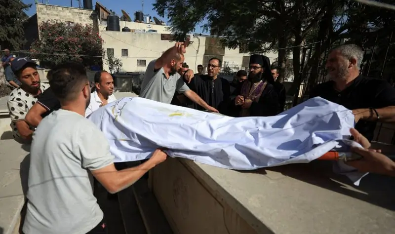 Mourners attend the burial of Palestinian Christians Saad Salama and Foumia Ayyad, who were killed in an Israeli strike on the Holy Family Church, according to medics, at the Greek Orthodox Saint Porphyrius Church, in Gaza City, July 17, 2025. REUTERS/Dawoud Abu Alkas