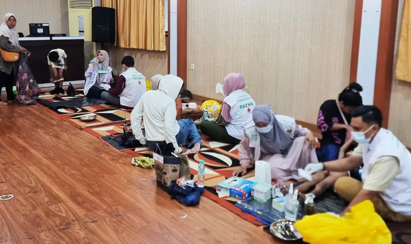 Suasana pelaksanaan sunatan massal memperingati Hari Pengayoman ke-80 di Kanwil Kemenkum SUlteng, Sabtu (9/8/2025). (©Kamenkum Sulteng)