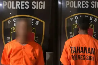Tersangka GS yang ditangkap aparat Polres Sigi atas dugaan pencruian menggunakan cadar. ©Humas Porles Sigi)