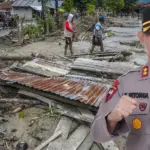 Ilustrasi bencana banjir bandang di Sigi beberapa waktu lalu. Inset, Kapolres Sigi AKBP Kari Amsah Ritonga. (©bmzIMAGES/Basri Marzuki)