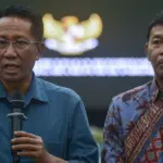 Anggota Tim Percepatan Reformasi Polri yangjuga Menkum Supratman Andi Agtas bersama Kapolri periode 2021-2023 Jend Pol (Porn) Idham Azis memberikan keterangan kepada wartawan usai Serap Aspirasi di KAuditorium UIN Datokarama Palu, Selasa (16/12/2025). (©bmzIMAGES/Basri Marzuki)