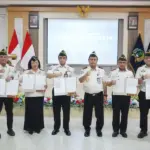 Kakanwil Ditjenpas Sulteng Bagus KUrniawan bersama sejumlah Kepala UPT Pemasyarakatan usai penandatangan kinerja 2026 di palu, Senin (5/1/2026). (©HUmas Ditjenpas Sulteng)