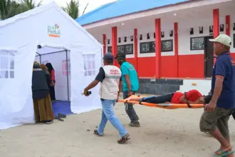 Simulasi tanggap darurat banjri bandang yang digelar di Desa Rogo, Dolo Selatan, Sigi, Minggu (15/2/2026). (©Rumah Dua Jari)